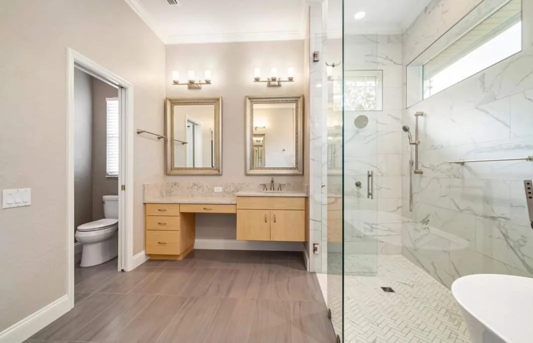 Double vanity lighting in a remodeled bathroom